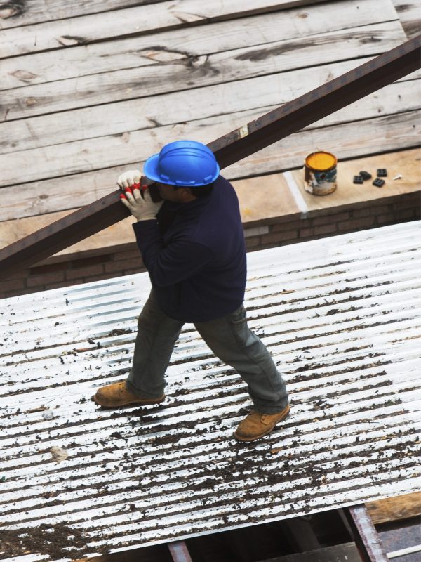 Construction worker walking on a snowy job site